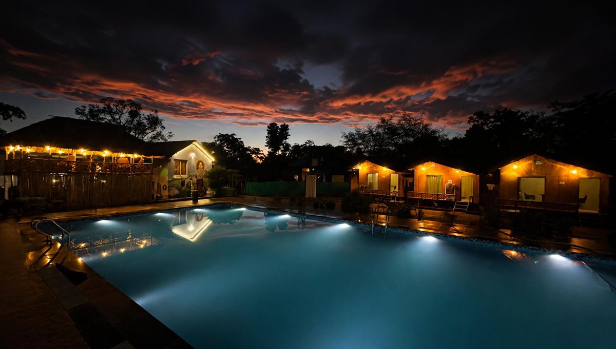 Bamboo Life Resort pool and cottages at dusk